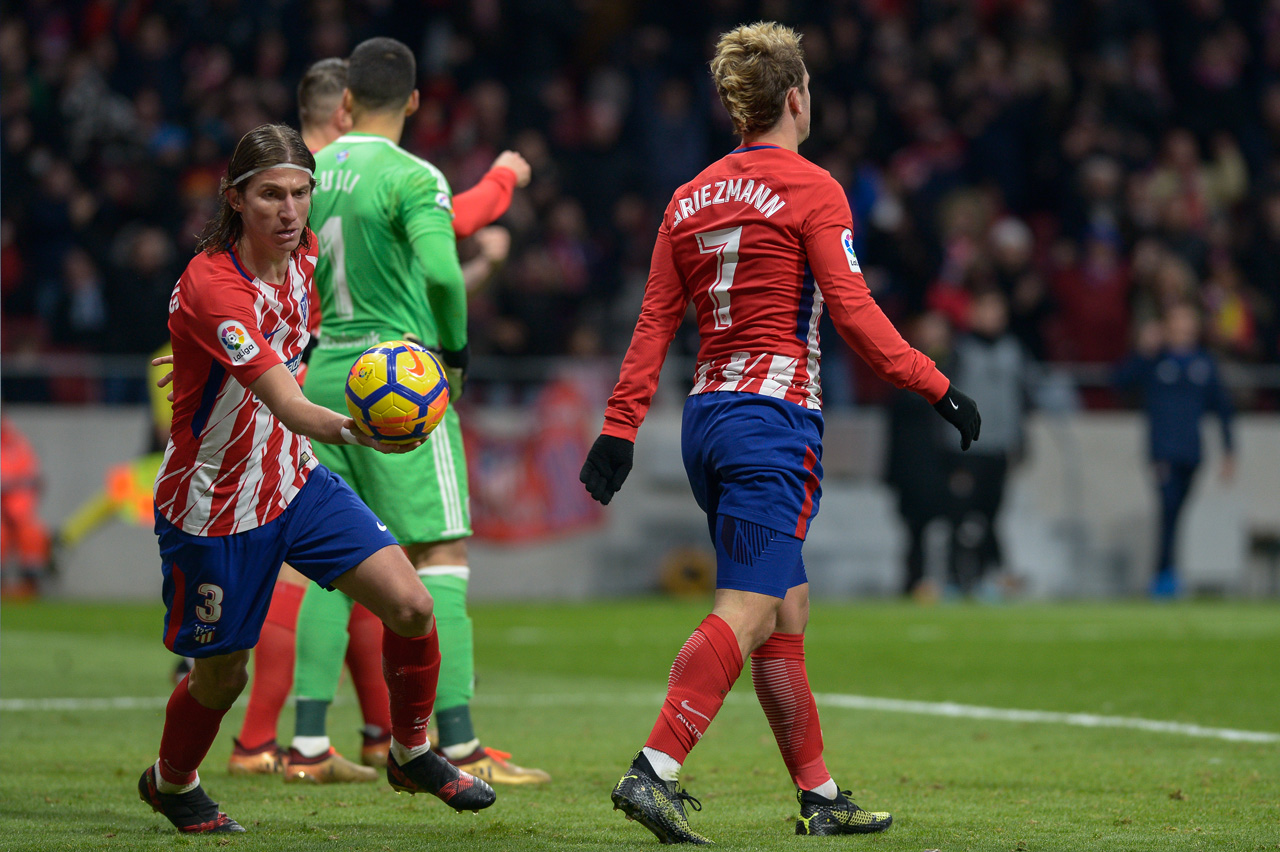 Filipe Luis y Antoine Griezmann