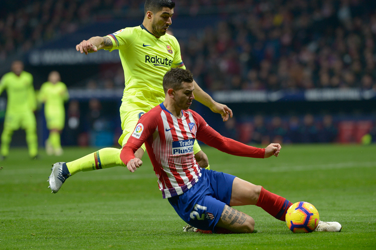 Lucas Hernández y Luis Suárez